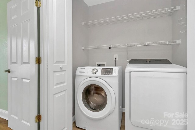 washroom with laundry area and separate washer and dryer