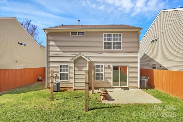 rear view of property with cooling unit, a patio area, a lawn, and a fenced backyard