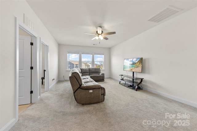 carpeted living room with visible vents, ceiling fan, and baseboards