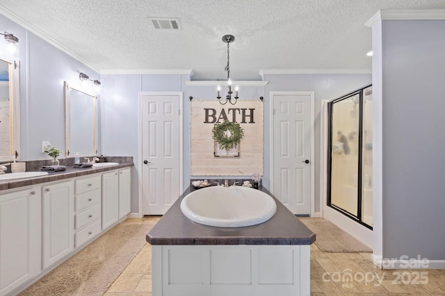 full bathroom featuring a sink, ornamental molding, a bath, double vanity, and a stall shower