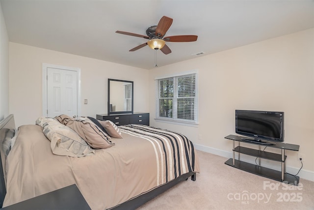 bedroom featuring visible vents, baseboards, a ceiling fan, and carpet flooring