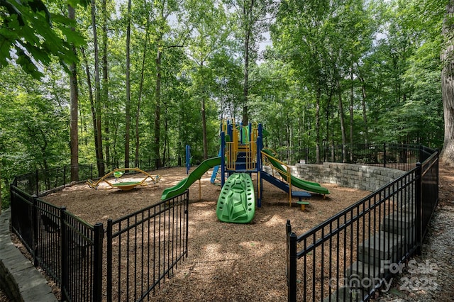 communal playground featuring fence