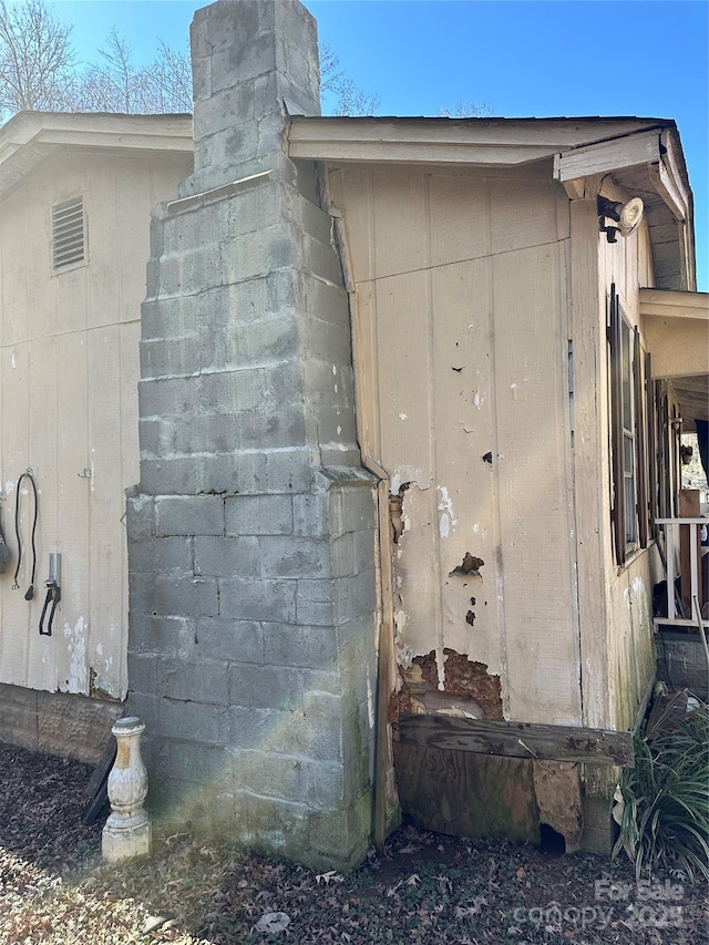 view of home's exterior featuring a chimney