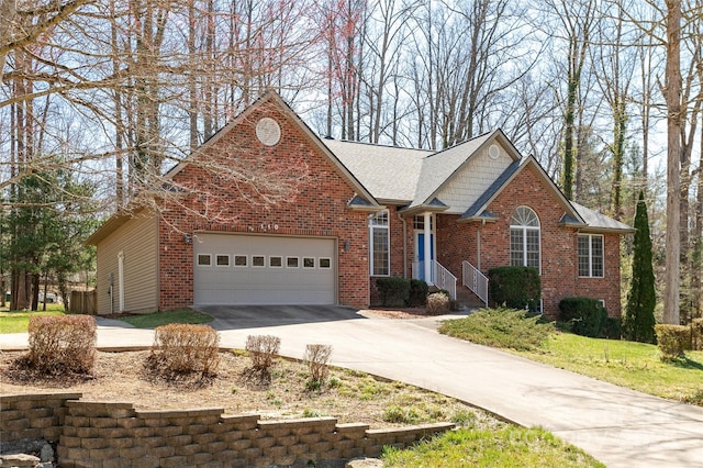 view of front facade featuring brick siding, concrete driveway, and an attached garage