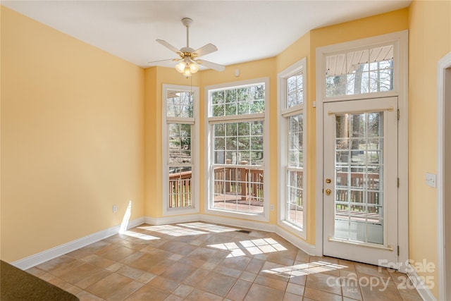 interior space featuring ceiling fan