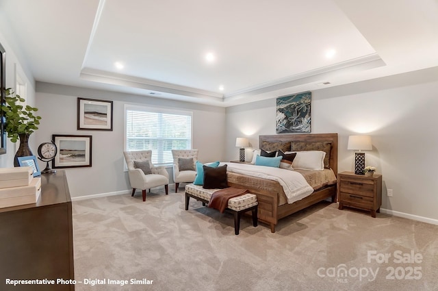 bedroom with baseboards, recessed lighting, a raised ceiling, and light colored carpet