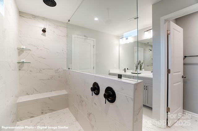 bathroom with recessed lighting, vanity, visible vents, marble finish floor, and a tile shower