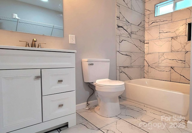 bathroom featuring baseboards, toilet, marble finish floor, vanity, and shower / bathing tub combination