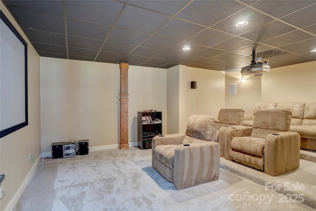 home theater room featuring carpet flooring, baseboards, and a drop ceiling