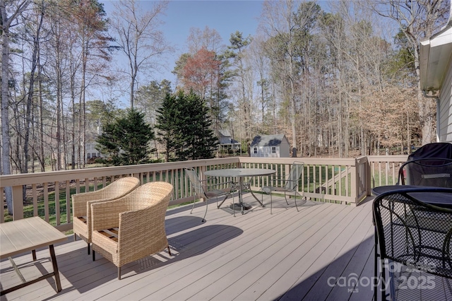 wooden terrace with an outdoor structure