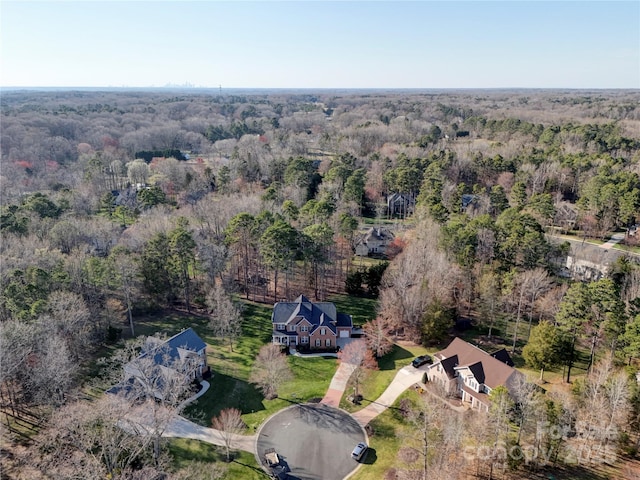 drone / aerial view featuring a view of trees