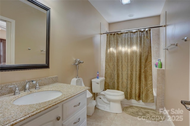 full bathroom with vanity, shower / bath combination with curtain, toilet, and tile patterned flooring