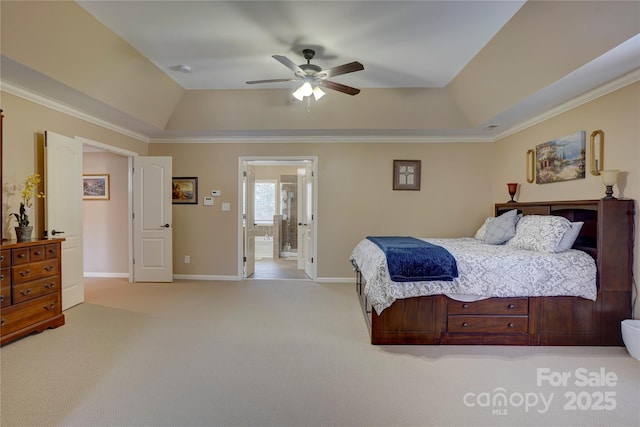 bedroom featuring a tray ceiling, light colored carpet, and baseboards