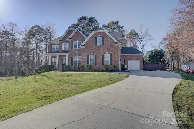 view of front of home featuring a garage, brick siding, concrete driveway, and a front yard