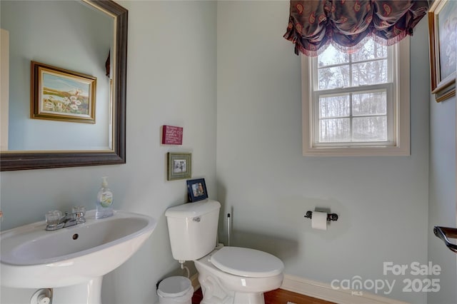 15100 Durmast Ct, Mint Hill, NC 28227 - half bath featuring a sink, toilet, and baseboards