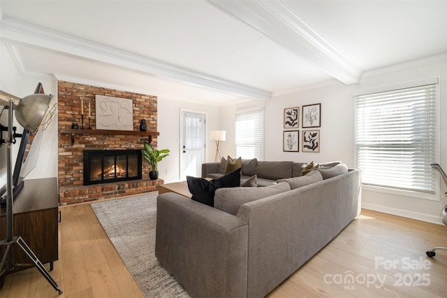 living area featuring baseboards, a fireplace, light wood-style floors, crown molding, and beamed ceiling