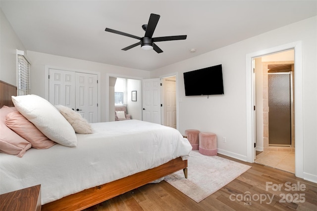 bedroom with a ceiling fan, wood finished floors, baseboards, a closet, and connected bathroom