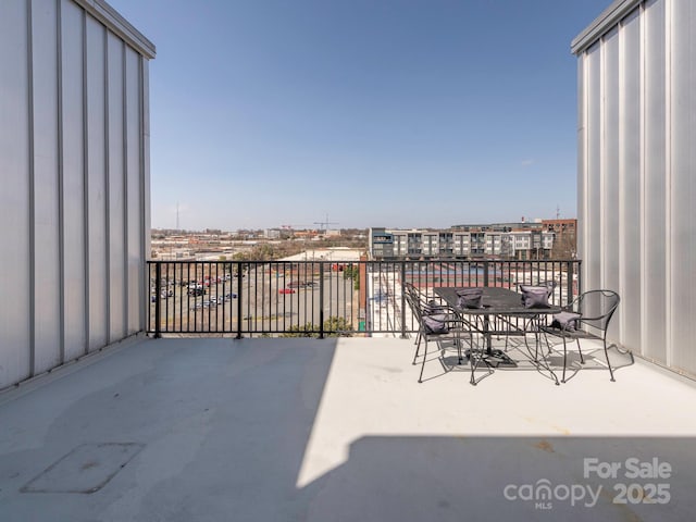 balcony featuring a city view