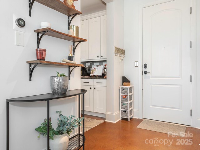 doorway with concrete floors