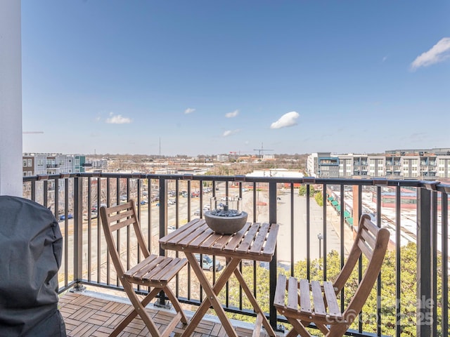 balcony featuring a city view and a grill