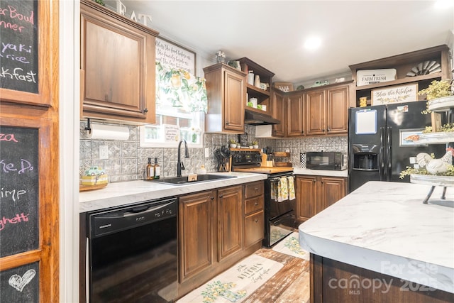 kitchen featuring open shelves, decorative backsplash, a sink, under cabinet range hood, and black appliances