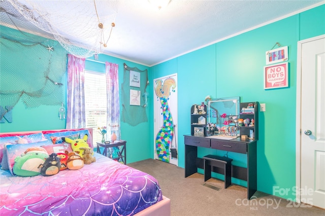 bedroom with carpet floors and ornamental molding