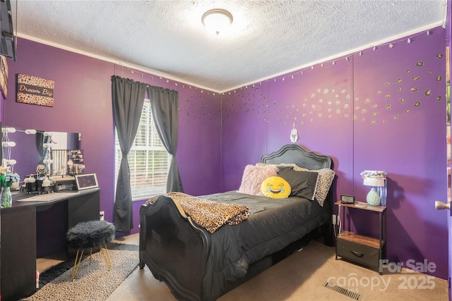 carpeted bedroom featuring visible vents and a textured ceiling