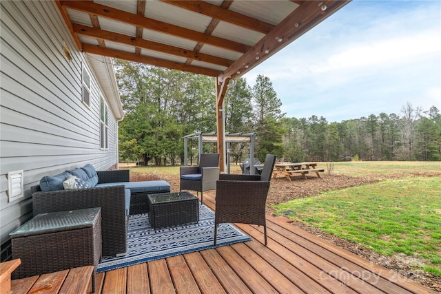 deck with an outdoor living space and a view of trees