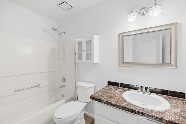 bathroom with visible vents, shower / tub combination, vanity, and toilet