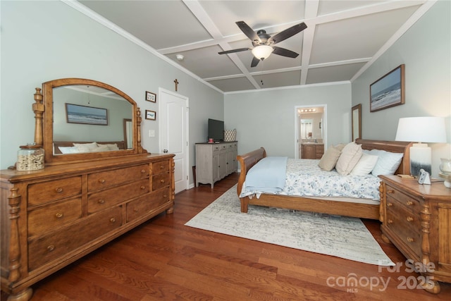 bedroom featuring coffered ceiling, a ceiling fan, dark wood finished floors, ensuite bath, and ornamental molding