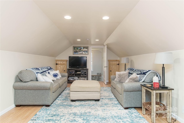 living room with recessed lighting, vaulted ceiling, baseboards, and wood finished floors