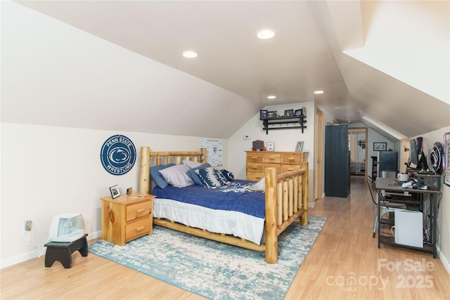 bedroom featuring lofted ceiling, recessed lighting, wood finished floors, and baseboards