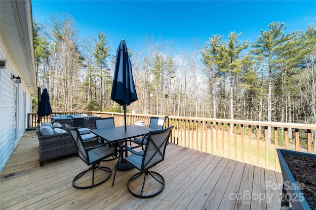 wooden deck with outdoor dining area