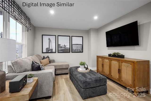 living area with light wood-type flooring, baseboards, and recessed lighting