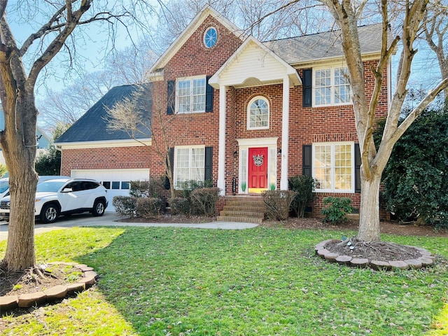 view of front facade featuring driveway, brick siding, a front lawn, and an attached garage