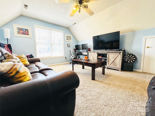 living area with carpet flooring, vaulted ceiling, visible vents, and a textured ceiling