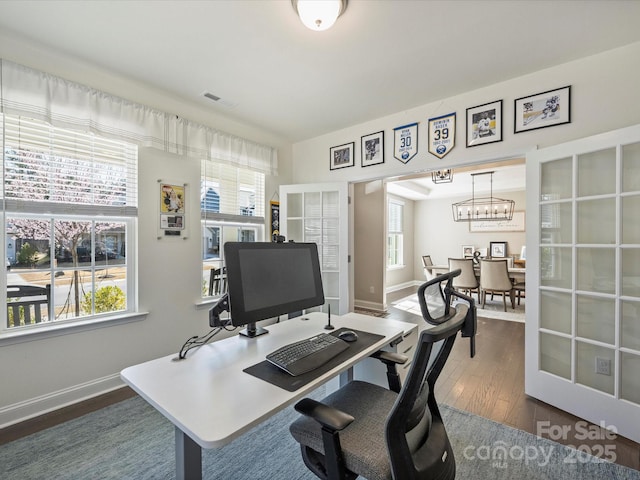 home office featuring an inviting chandelier, visible vents, dark wood-style floors, and baseboards