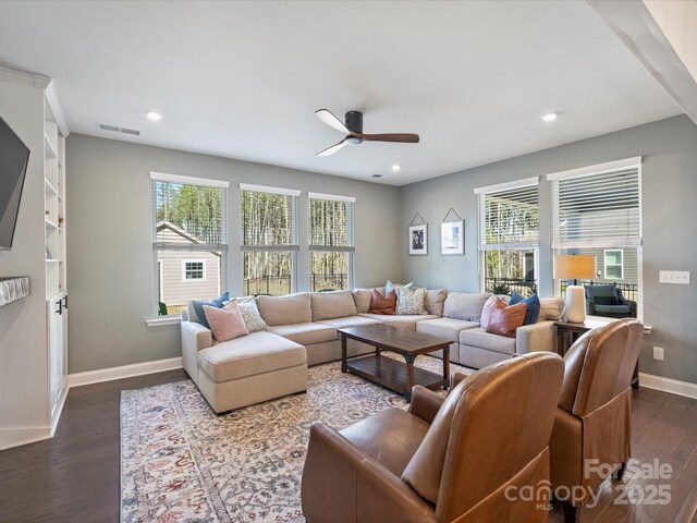 living room with a ceiling fan, baseboards, visible vents, recessed lighting, and dark wood-type flooring