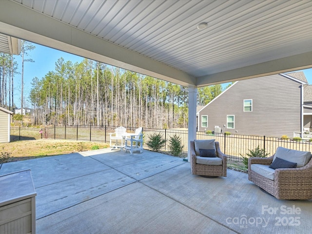 view of patio featuring an outdoor living space and fence private yard