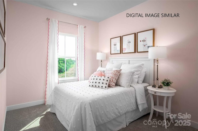 bedroom featuring carpet and baseboards