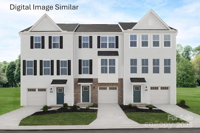 townhome / multi-family property featuring a front lawn, concrete driveway, and brick siding