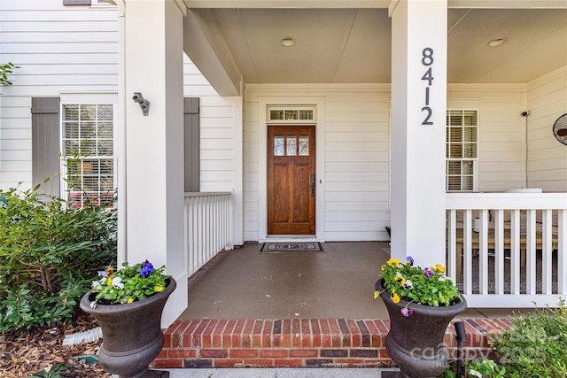 doorway to property with covered porch