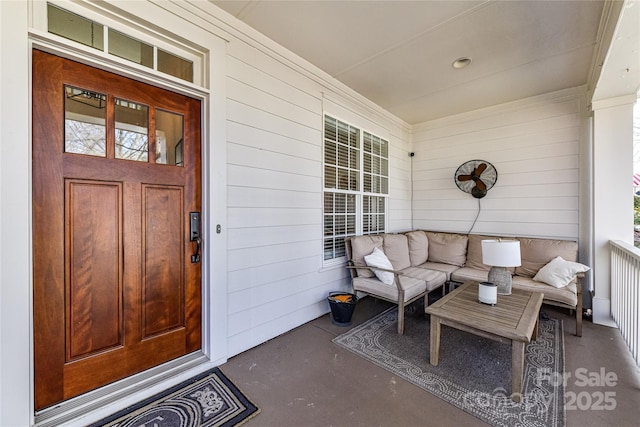 property entrance with an outdoor living space and covered porch