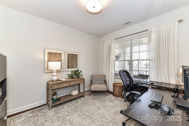 office featuring visible vents and baseboards