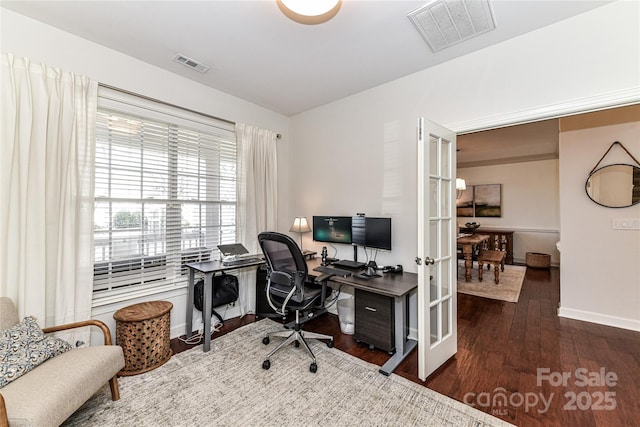 office featuring wood finished floors, visible vents, french doors, and baseboards