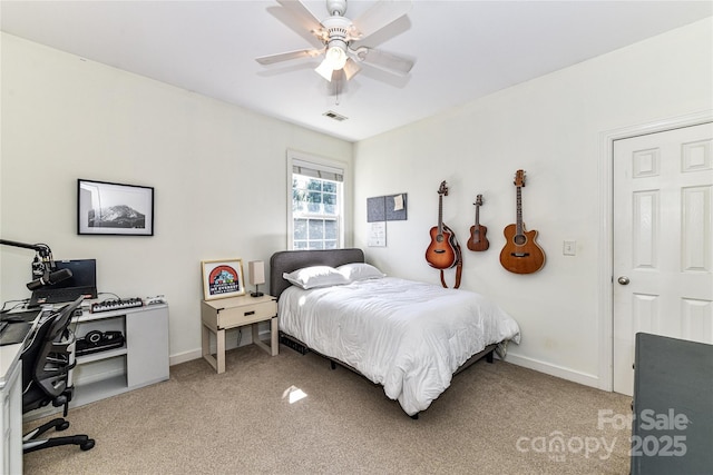 bedroom featuring ceiling fan, baseboards, visible vents, and light carpet