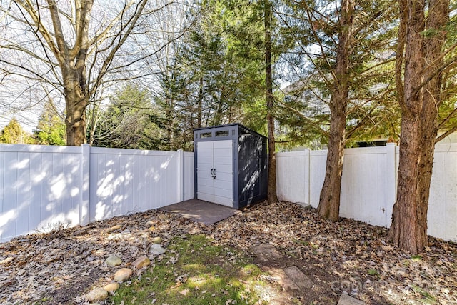 view of shed featuring a fenced backyard