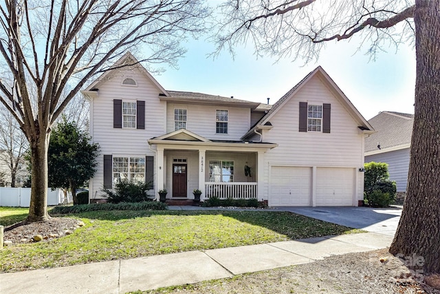 traditional home featuring a front lawn, driveway, a porch, fence, and a garage