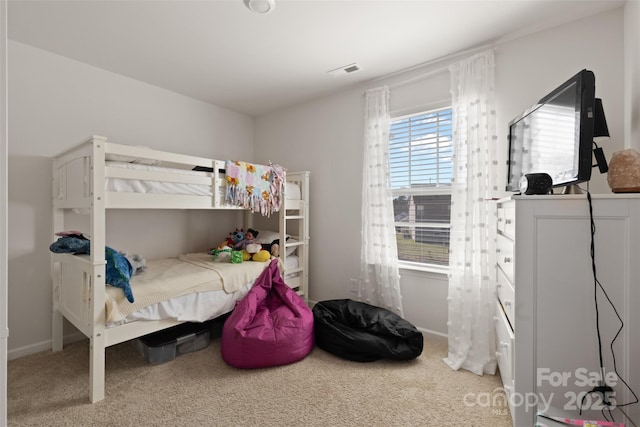 bedroom featuring carpet flooring, baseboards, and visible vents