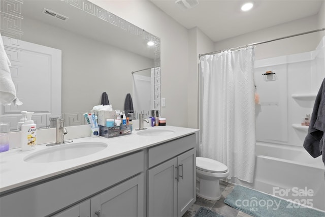 full bath featuring toilet, shower / bath combo, visible vents, and a sink